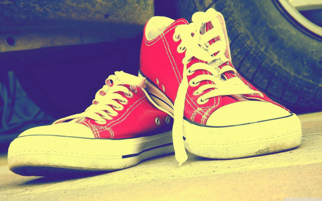 Red sneakers next to tires free wallpaper for desktop - medium preview image
