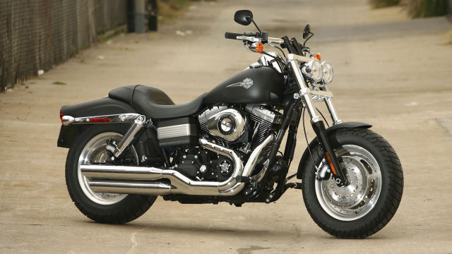 Black motorcycle sidewalk fence building free wallpaper for desktop - medium preview image