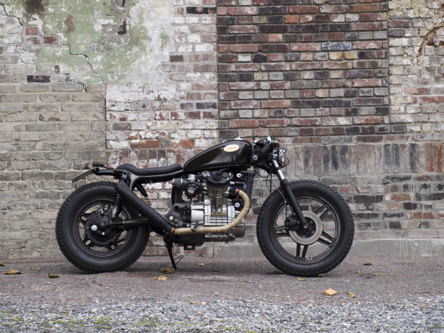 Motorcycle parked brick wall black free wallpaper for desktop - medium preview image