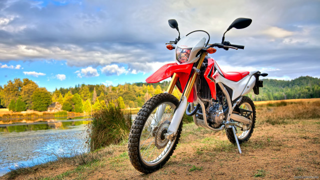 Red motorcycle dirt field river free wallpaper for desktop - medium preview image