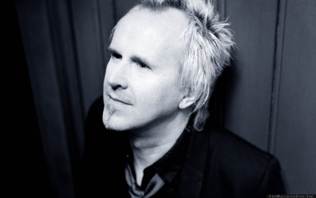 Man messy bun serious look free wallpaper for desktop - medium preview image