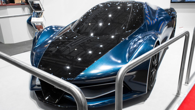 Futuristic car showroom exhibition display free wallpaper for desktop - medium preview image