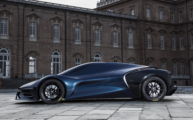 Futuristic car parked large building #2 free wallpaper for desktop - medium preview image