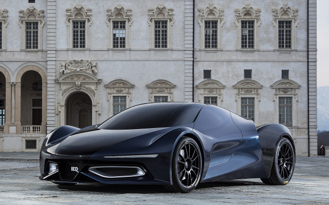 Futuristic car parked large building #3 free wallpaper for desktop - medium preview image