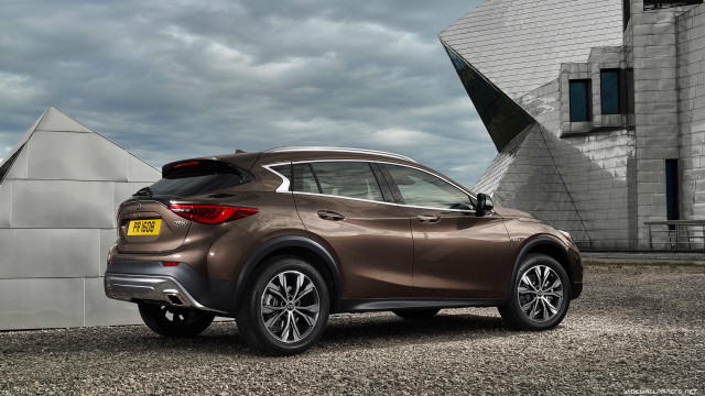 Brown car parked building large free wallpaper for desktop - medium preview image