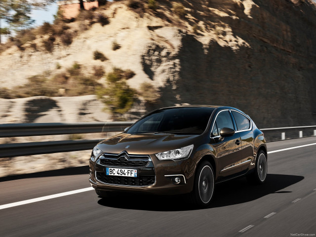 Brown car driving road mountain free wallpaper for desktop - medium preview image