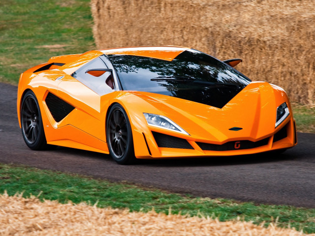 Orange sports car driving hay free wallpaper for desktop - medium preview image