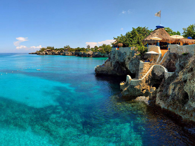 Beach thatched roof blue lagoon free wallpaper for desktop - medium preview image