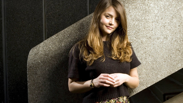 Woman standing wall hands folded free wallpaper for desktop - medium preview image