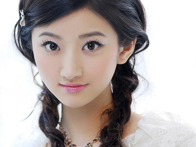 Woman braid necklace white shirt free wallpaper for desktop - medium preview image