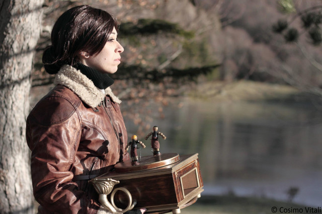 Woman holding wooden box figurines free wallpaper for desktop - medium preview image