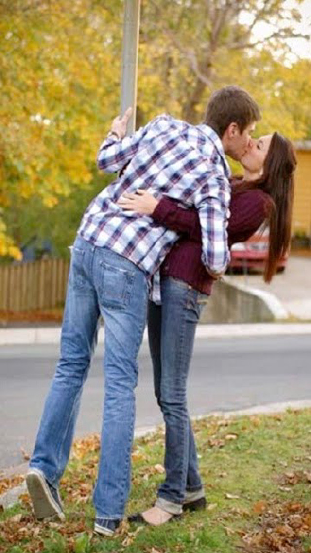 Man woman kissing autumn park free wallpaper for mobile - medium preview image