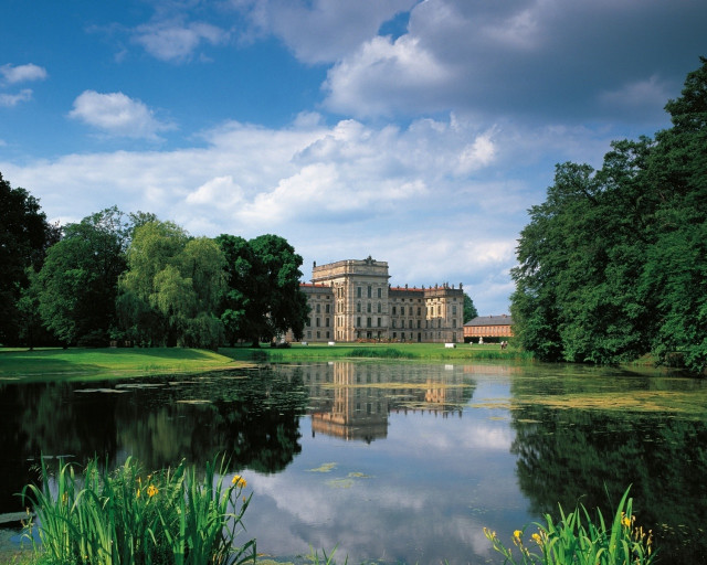 Large building lush green field free wallpaper for desktop - medium preview image