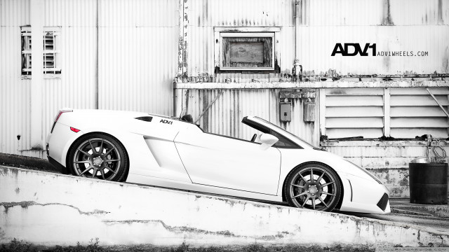 White sports car concrete ledge free wallpaper for desktop - medium preview image