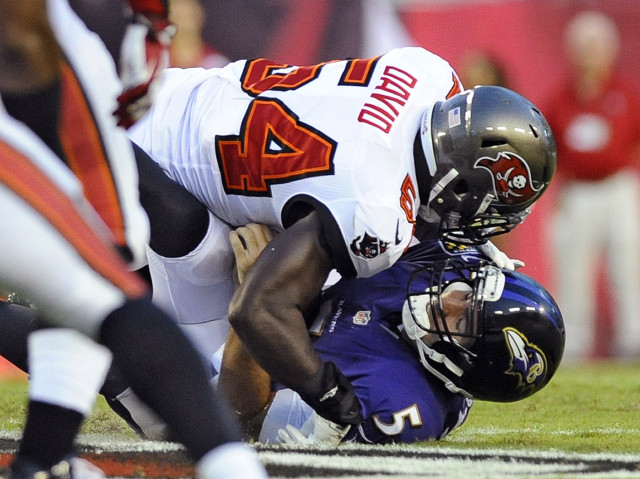 Football player tackled on field free wallpaper for desktop - medium preview image