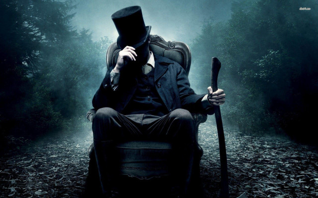 Man top hat coat sitting free wallpaper for desktop - medium preview image