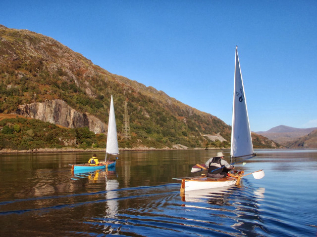 Small boats lake mountain person free wallpaper for desktop - medium preview image