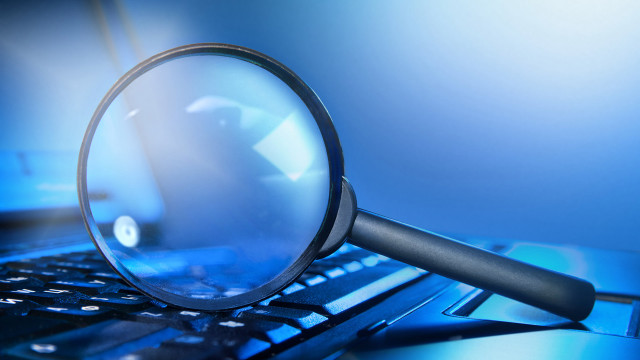 Magnifying glass laptop keyboard desk free wallpaper for desktop - medium preview image