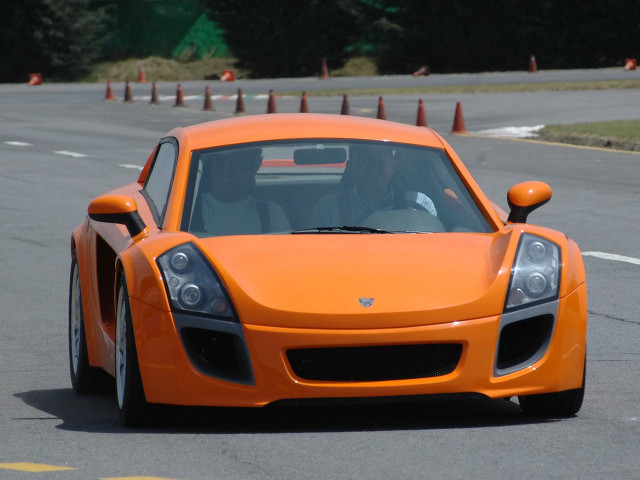 Orange sports car race track free wallpaper for desktop - medium preview image