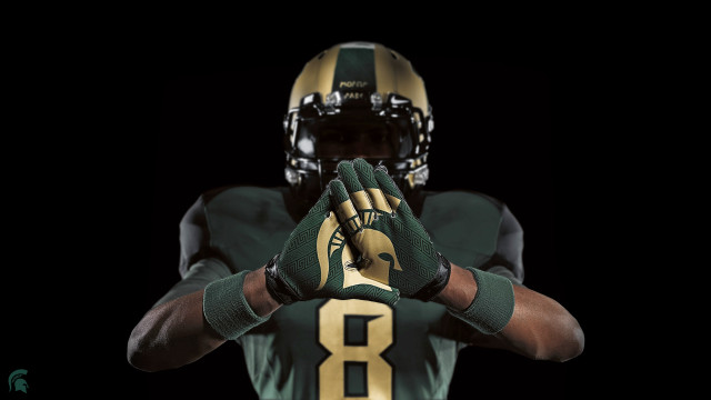 Football player green gold uniform free wallpaper for desktop - medium preview image
