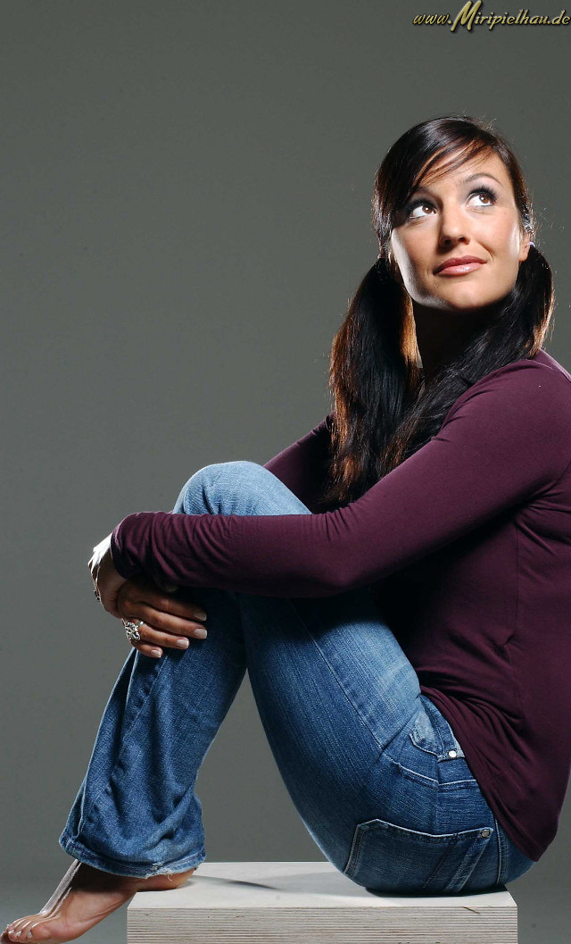 Woman sitting concrete pose portrait free wallpaper for mobile - medium preview image