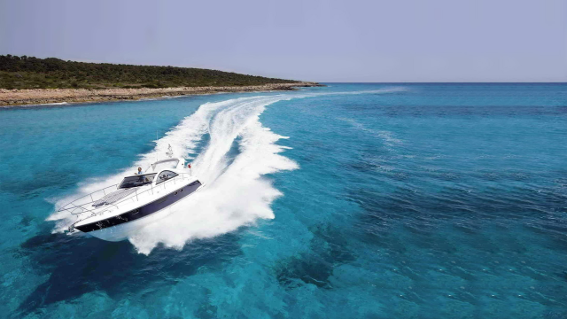 Boat shore island sky water free wallpaper for desktop - medium preview image