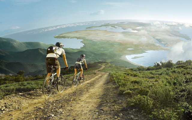 Couple biking dirt road lake free wallpaper for desktop - medium preview image