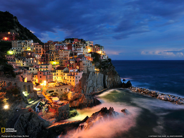 Town cliff ocean night lights free wallpaper for desktop - medium preview image