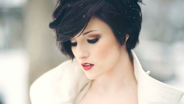 Woman black hair white jacket free wallpaper for desktop - medium preview image