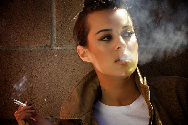Woman smoking cigarette brick wall #2 free wallpaper for desktop - medium preview image