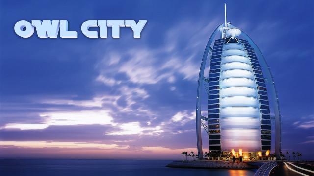 Tall building water beach sky free wallpaper for desktop - medium preview image