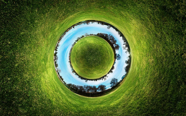 Circular grassy field blue pond free wallpaper for desktop - medium preview image