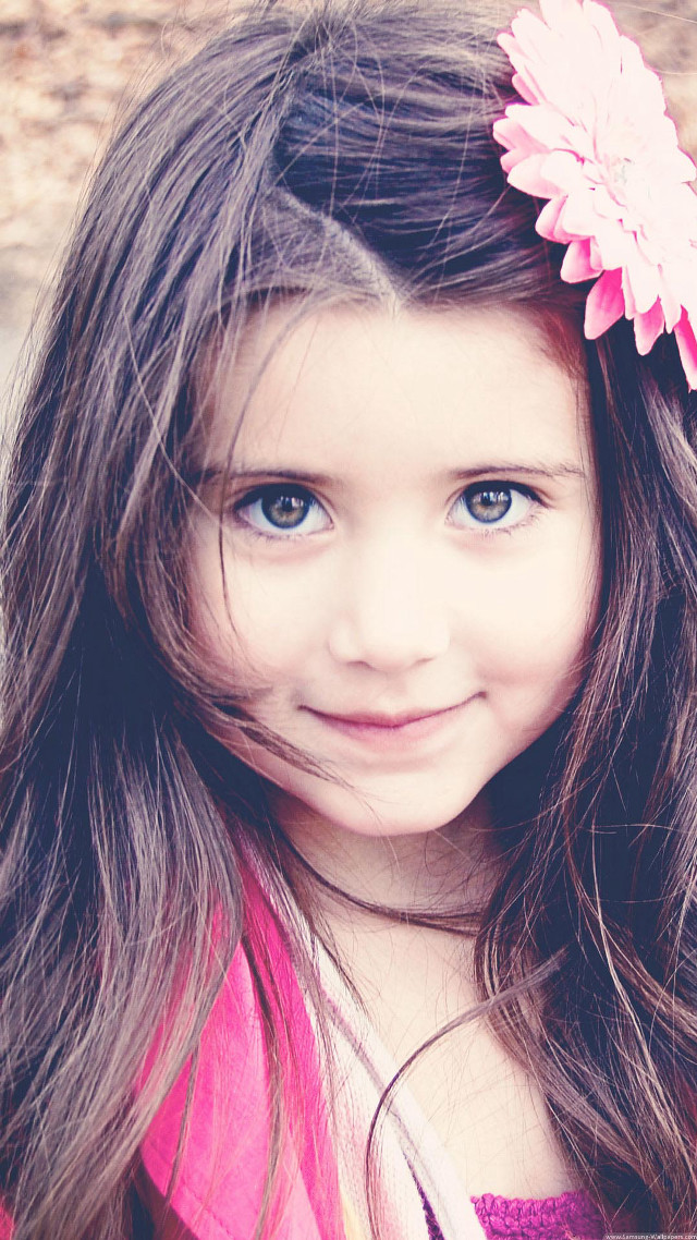 Little girl smiling camera pink free wallpaper for mobile - medium preview image