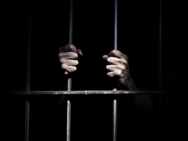 Person holding jailcell bars dark free wallpaper for desktop - medium preview image