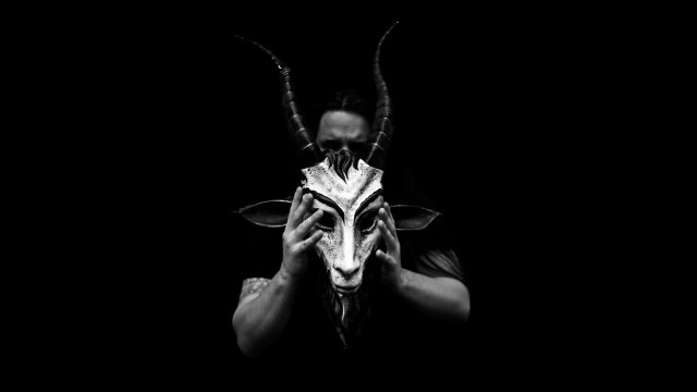 Man holding mask horned animal free wallpaper for desktop - medium preview image
