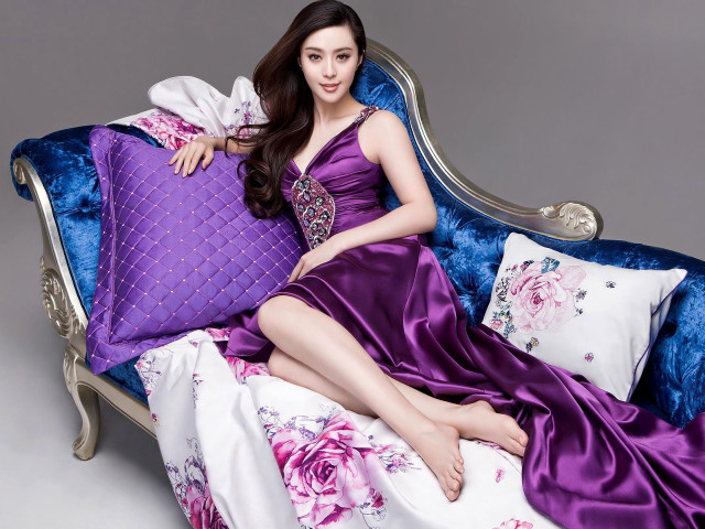 Woman purple dress blue couch free wallpaper for desktop - medium preview image