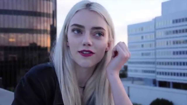 Blonde woman black shirt cityscape free wallpaper for desktop - medium preview image