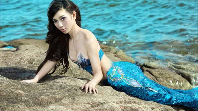 Woman blue mermaid suit rock free wallpaper for desktop - medium preview image