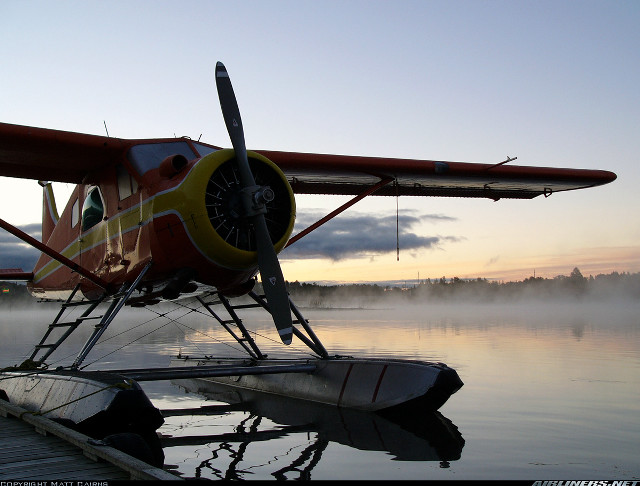 Small plane lake dock person free wallpaper for desktop - medium preview image