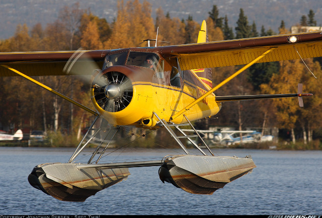 Yellow red plane flying water free wallpaper for desktop - medium preview image
