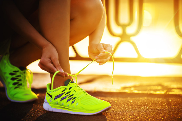 Woman tying shoelaces tennis shoe free wallpaper for desktop - medium preview image