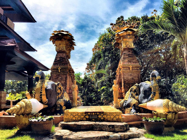 Statues lush green field building free wallpaper for desktop - medium preview image