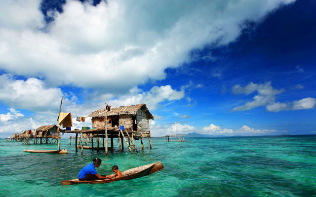 Man child boat house stilts free wallpaper for desktop - medium preview image