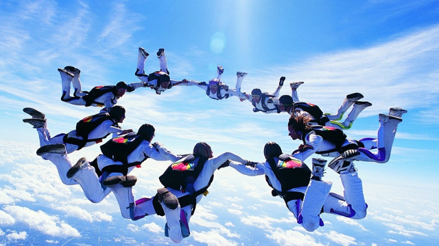 Flying people circle air arms free wallpaper for desktop - medium preview image