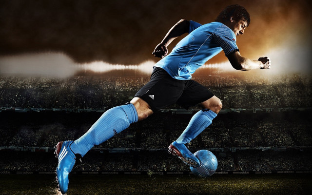 Soccer player kicking ball stadium #4 free wallpaper for desktop - medium preview image