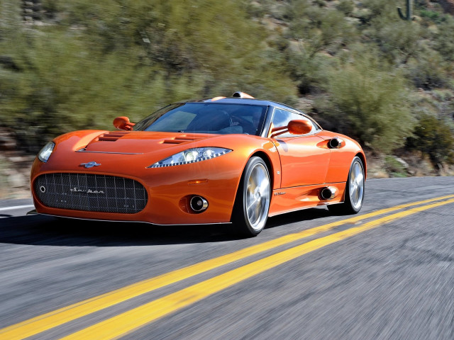 Orange sports car driving road free wallpaper for desktop - medium preview image