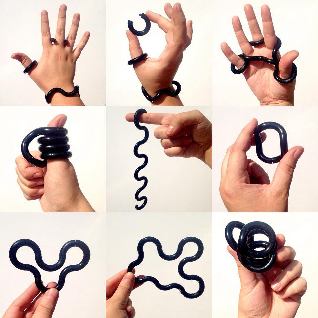 Hands holding black object spiral free wallpaper for tablet - medium preview image