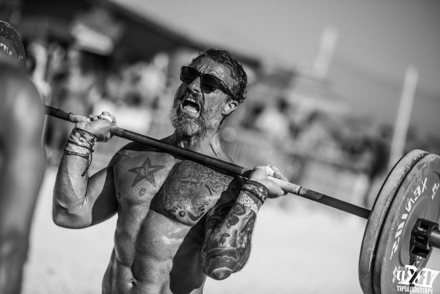 Bearded man tattoos holding barbell free wallpaper for desktop - medium preview image