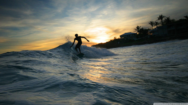Man surfing wave sunset house free wallpaper for desktop - medium preview image