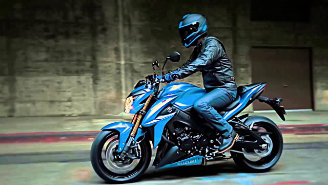 Man riding blue motorcycle graffiti free wallpaper for desktop - medium preview image